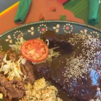 Mole Poblano · Quarter of chicken, rice and beans.