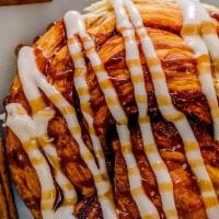 Cinnamon Roll · A rich brioche dough, layered with butter and cinnamon sugar and topped with frosting and ci...