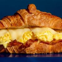 Scrambled Egg And Cheese Sandwich · Flaky Butter Croissant filled with Scrambled Eggs and Swiss Cheese.
