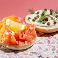 Lox Bagel · Plain Bagel topped with whipped cream cheese, smoked salmon, dill, capers, pickled red onion...