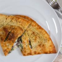 Veggie Calzone · Regular calzone stuffed with mozzarella, ricotta, spinach, tomato,green bell peppers, and mu...