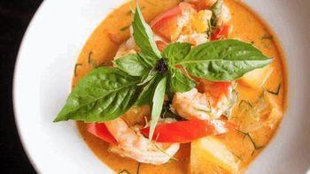 Pineapple Prawn Curry · Red chili paste simmered with coconut milk, pineapple, prawns, bell pepper, basil, and zucch...