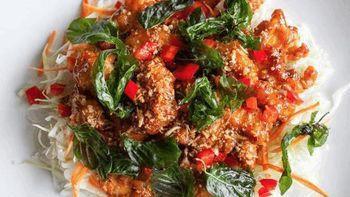 Crispy Garlic Chicken · Crispy chicken‏ pieces are stir-fried with garlic, red bell peppers, crispy basil leaves and...
