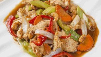 Cashew Nut Chicken · Stir-fried chicken with chili paste, cashew nuts, pepper, onion, carrots, celery and snow pea.