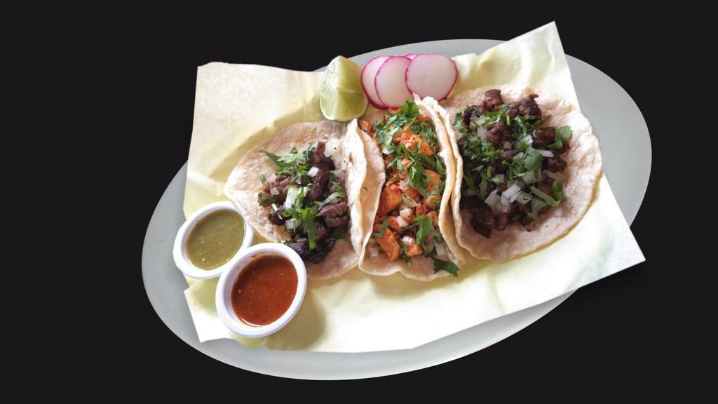 Tacos · Corn tortilla with your choice of meat, onions, and cilantro. Radishes, lime, sauteed onions, jalapenos, and salsa on the side.