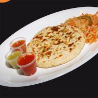 Pupusas · Thick hand-made tortilla filled with either pork rinds and cheese or just cheese, served wit...