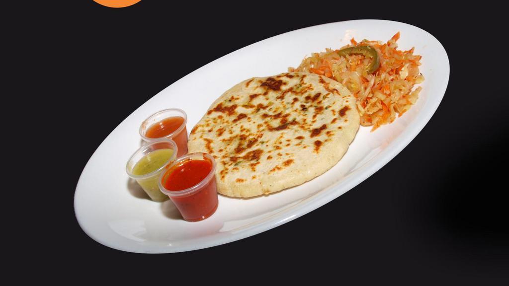 Pupusas · Thick hand-made tortilla filled with either pork rinds and cheese or just cheese, served with cabbage salad and a mild tomato sauce.