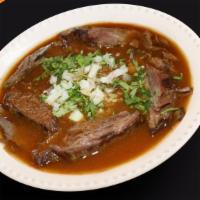 Birria · Beef soup served with rice, onions, cilantro, and jalapeno along with your choice of tortill...