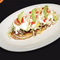 Huarache · Long tortilla that is deep fried, topped with beans, choice of meat, lettuce, sour cream, sa...