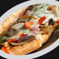  Philly Cheesesteak · Thin sliced beef on pressed ciabatta bread topped with sauteed bell peppers, red onions, and...