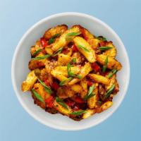 Corn Manchurian Madness · Fresh baby corn, seasoned, batter-fried, and sauteed with green onions and Indo-Chinese Manc...