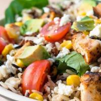Southwest Bowl · Wild Rice Blend, Southwestern Chicken, Spinach, Roasted Corn, Avocado, Tomatoes, Cotija Chee...