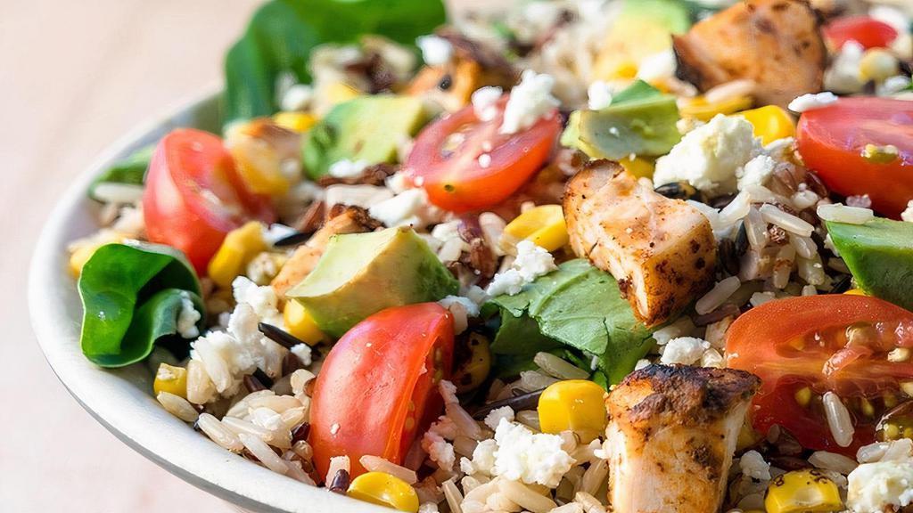 Southwest Bowl · Wild Rice Blend, Southwestern Chicken, Spinach, Roasted Corn, Avocado, Tomatoes, Cotija Cheese with Cilantro Chili Lime Dressing