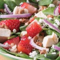 Vibrant Venus · Spinach, House Grilled Chicken, Strawberries, Goat Cheese, Praline Pecans, Red Onions with B...