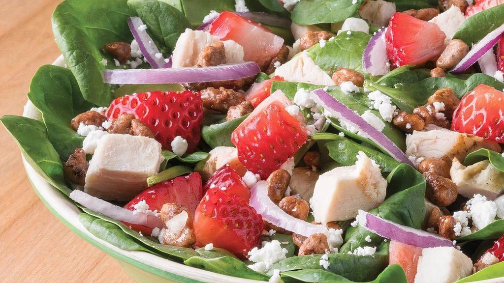 Vibrant Venus · Spinach, House Grilled Chicken, Strawberries, Goat Cheese, Praline Pecans, Red Onions with Balsamic Vinaigrette