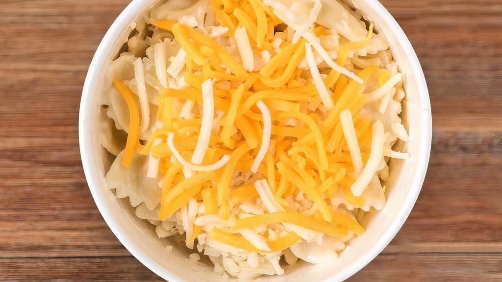 Mini Mac Bowl · White Cheddar Mac topped with Cheddar and Jack Cheeses + Milk or Juice