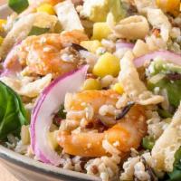 Baja Shrimp Bowl · Wild Rice Blend, Spinach, Shrimp, Avocado, Mango, Cotija Cheese, Pickled Onions, Wonton Stri...