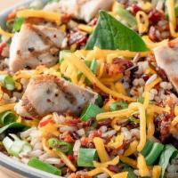 Spicy Bacon Bowl · Wild Rice Blend, House Grilled Chicken, Spinach, Green Onions, Cheddar Cheese, Bacon, MAD Sp...