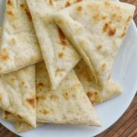 Warm Pita Bread · A light and fluffy tool to help you get that last bite on to your fork. Or just to eat..