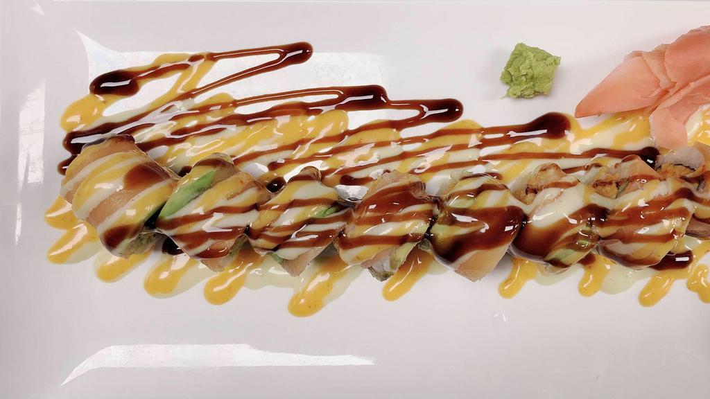 Spicy Salmon Roll · Spicy crab meat avocado inside Top salmon avocado spicy & eel sauce.