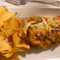 Santa Fe Relleno · Soft chile relleno filed with cheddar and jack cheese, shredded chicken smothered with veget...