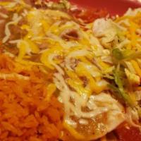 Combinations 2 · Our house favorites: shredded beef or chicken taco, smothered beef and bean burrito, and a c...