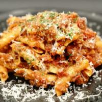 Bolognese (House Specialty) · House-made Bolognese, Organic Rigatoni Pasta, Parmesan Reggiano, Parsley.
