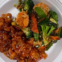 Dragon And Phoenix · Hot & Spicy. Shrimp with chili sauce in one side and General Tso's Chicken on the other side.