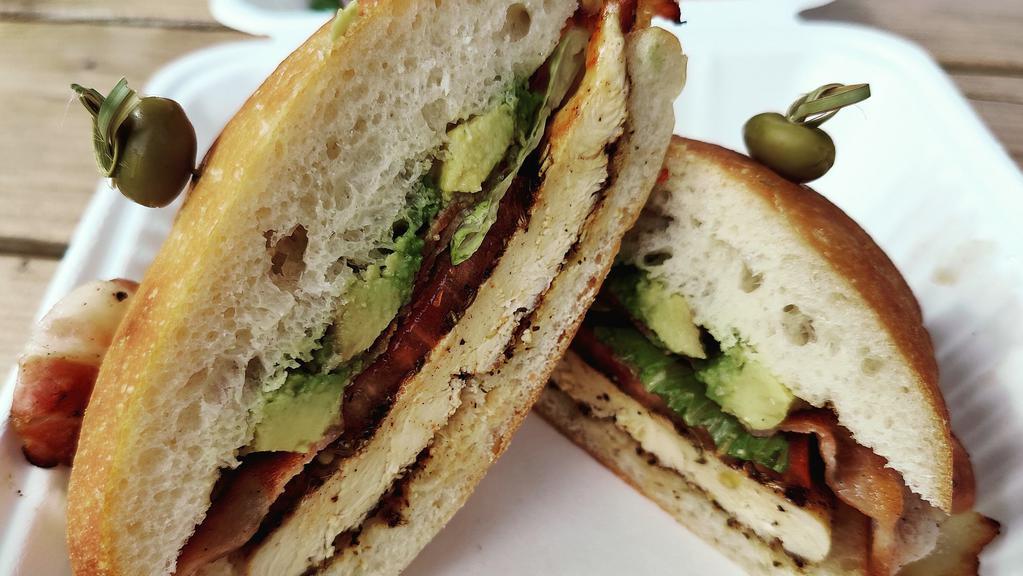 Chicken & Avocado Blt · Our tuscan chicken served on a ciabatta style bollo roll, piled high with avocado, bacon, lettuce and tomato. Served with your choice of our house salad or French fries.