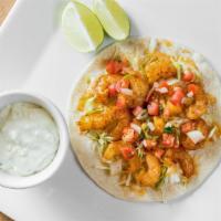 Saucy Shrimp · Marinated shrimp cooked bell pepper, onion, sour cream, rice & cheese in a soft shell tortil...