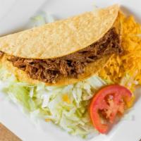 Crunchy Shredded Beef Taco · Hardshell tortilla with shredded beef, lettuce, and cheese. Add Extra Toppings for an additi...