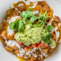 Pork Showdown · Braised pork shoulder and special spices, and topped with cheese, sour cream, and guacamole....
