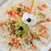 Creator Of Quesadillas · A grilled flour tortilla with choice of protein topped with melted Jack and Cheddar cheese, ...