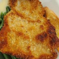 Pork Schnitzel · Breaded and fried pork tenderloin with mashed potatoes, green beans, and Dijon ale cream sauce