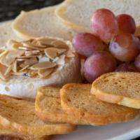 Baked Brie · local lavender honey + toasted almonds + grapes + crostini + french baguette