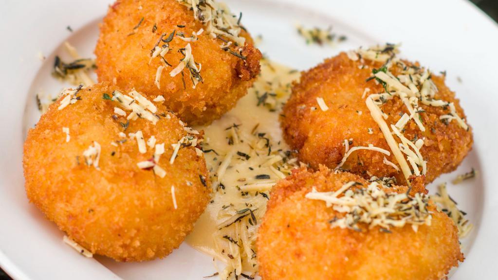 Mac & Cheese Bites · creamy four-cheese blend + lightly fried + panko breading + tillamook® cheddar sauce + hatch green chile