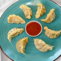 Momo (8 Pieces) · Homemade Himalayan dumplings - ground meat marinated with spices, wrapped in wonton wrappers...