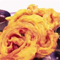 Onion Bajji · Seasoned onions dipped in lentil flour and deep fried.