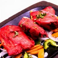 Chicken Tandoori · Bone in leg quarters marinated in spices and cooked in tandoor oven.