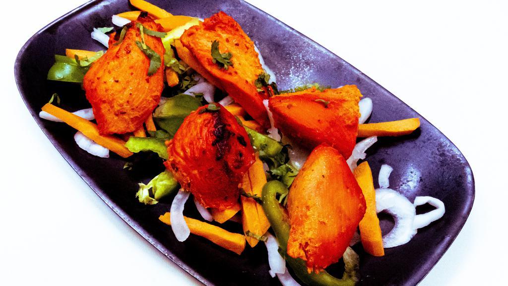 Chicken Tikka · Boneless chicken breast meat marinated in spices and cooked in tandoor oven.