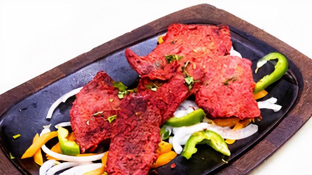 Lamb Boti Kabab · Tender lamb pieces marinated in spices and cooked in tandoor oven.
