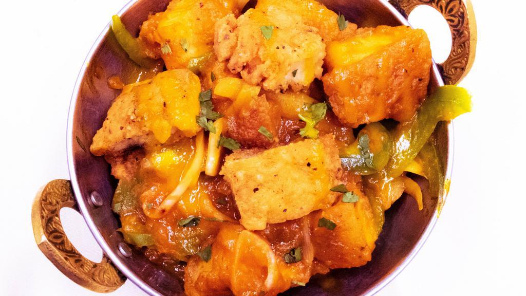 Mango Chicken · Boneless breaded chicken tenders deep fried and sauteed with mangoes bell peppers onions turmeric and spices.