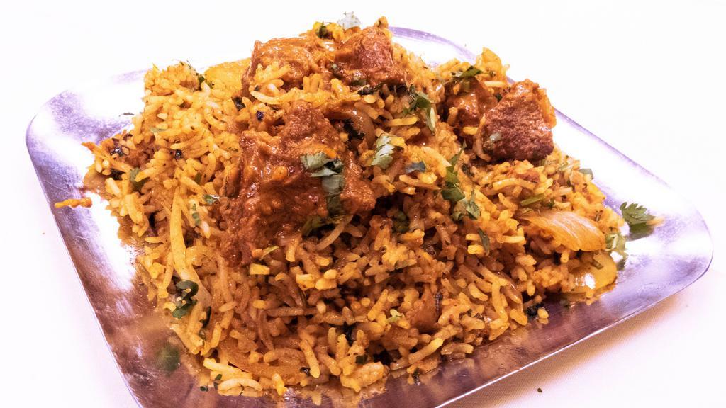 Lamb Biryani · Aromatic basmati rice with lamb pieces cooked with herbs and butter and spices.