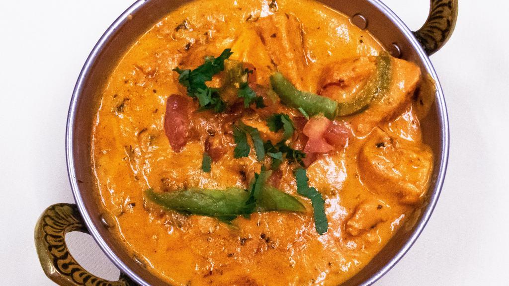 Chicken Tikka Masala · Boneless chicken breast pieces cooked with bell peppers cream tomatoes and spices.