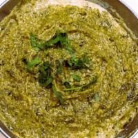 Saag Paneer · Spinach cooked with homemade cheese cream and seasoned with herbs.