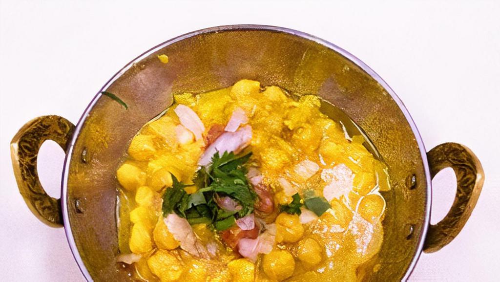Channa Masala · Garbanzo beans cooked with onion tomatoes and mild spices.