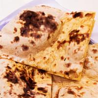 Roti · Indian whole wheat bread baked in tandoor overt.