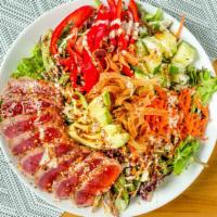Togarashi Ahi Salad · Thinly sliced seared togarashi ahi, mixed greens, cabbage, carrots, red bell peppers and cuc...