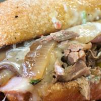 Paseo Press · Slow-roasted pork shoulder, smoked ham, banana peppers, fresh cilantro, caramelized onions, ...