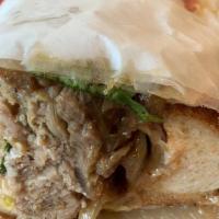 Ham And Cheese · Smoked ham, banana peppers, fresh cilantro and caramelized onions topped with melted Swiss c...